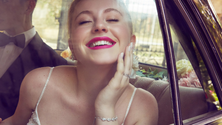 bride looking out the window and smiling